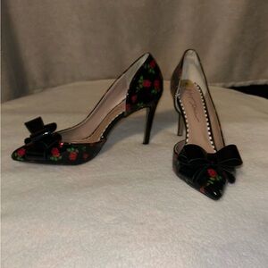 Black heels with rose embellishments Betsy Johnson size 8